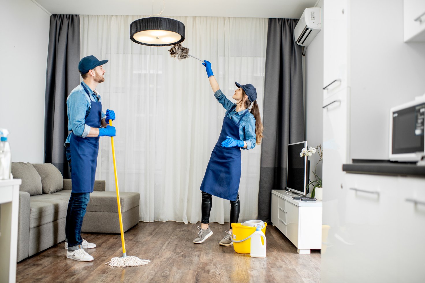 Housekeepers Cleaning the Apartment