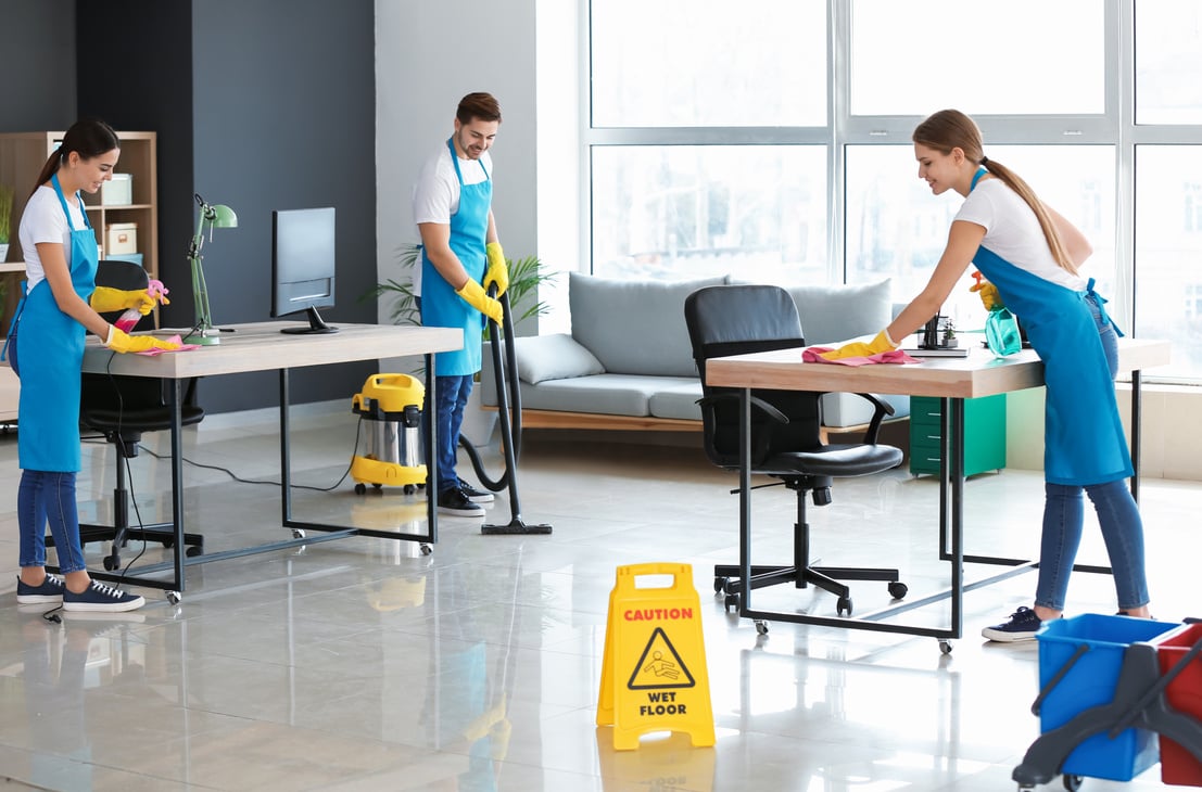 Team of Janitors Cleaning Office